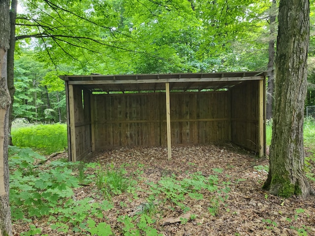 view of outbuilding with a carport