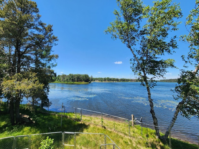 water view featuring a gate and fence