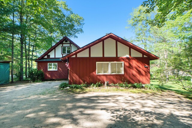 view of side of property with driveway