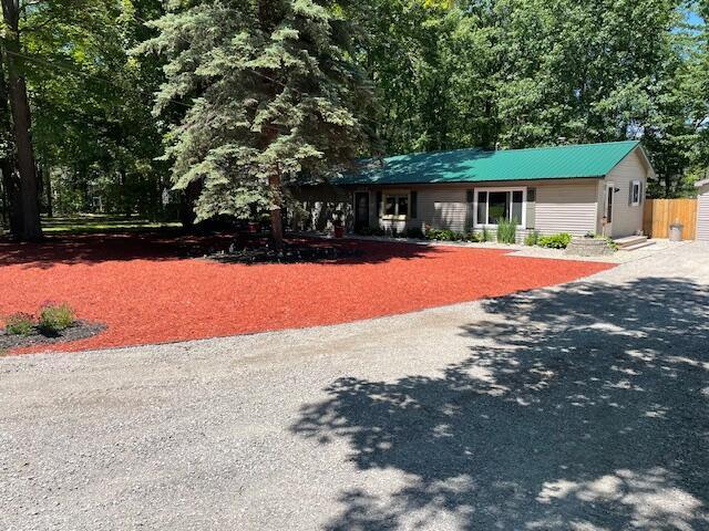 view of front of house with metal roof and a garage