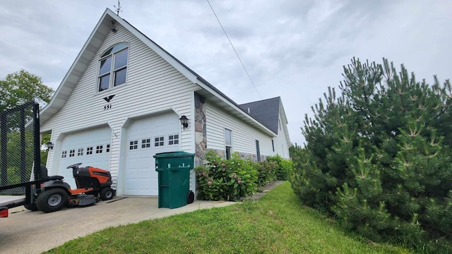 551 S US-23, Harrisville, MI 48740 - view of home's exterior featuring a garage and driveway