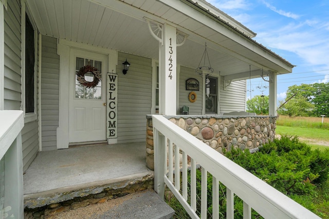 property entrance with covered porch