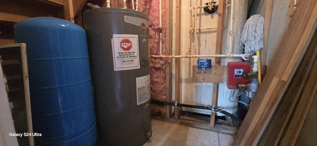 utility room featuring water heater