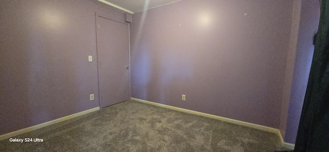 unfurnished bedroom with baseboards and carpet floors