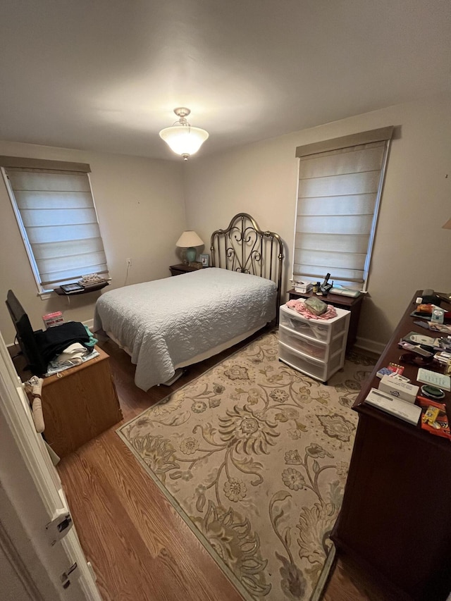 bedroom with wood finished floors