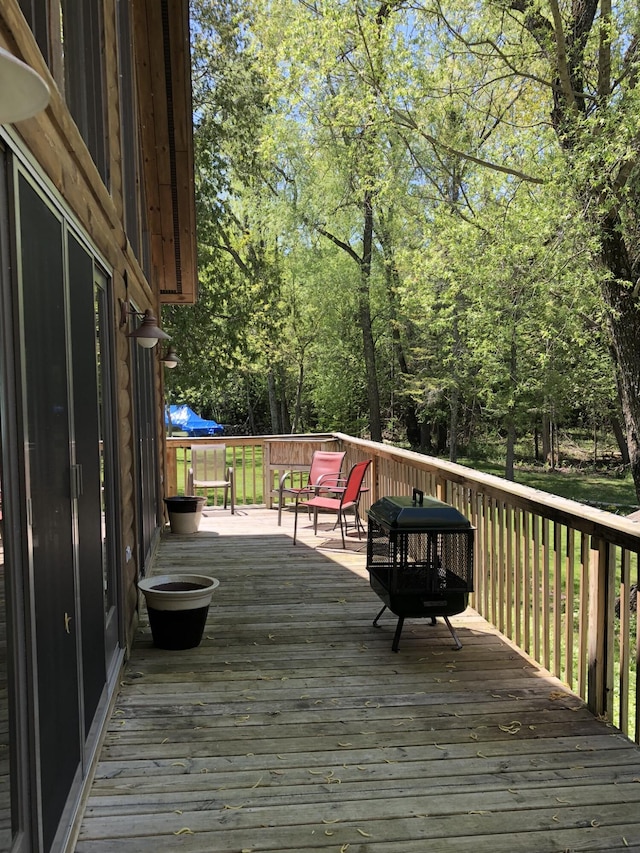 wooden deck featuring grilling area