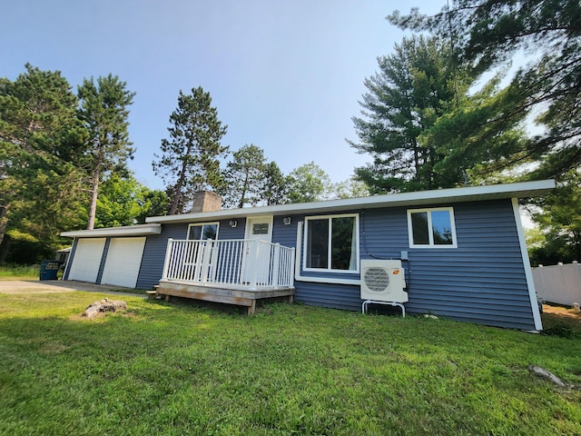 single story home with a front lawn, ac unit, a chimney, a garage, and driveway