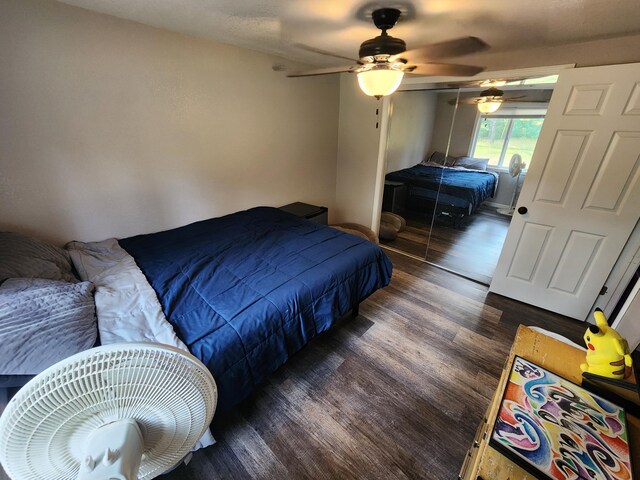 bedroom featuring wood finished floors, a closet, and ceiling fan