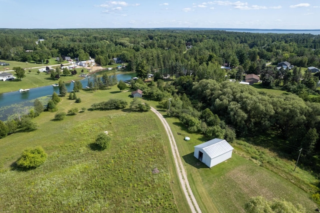 bird's eye view featuring a view of trees and a water view