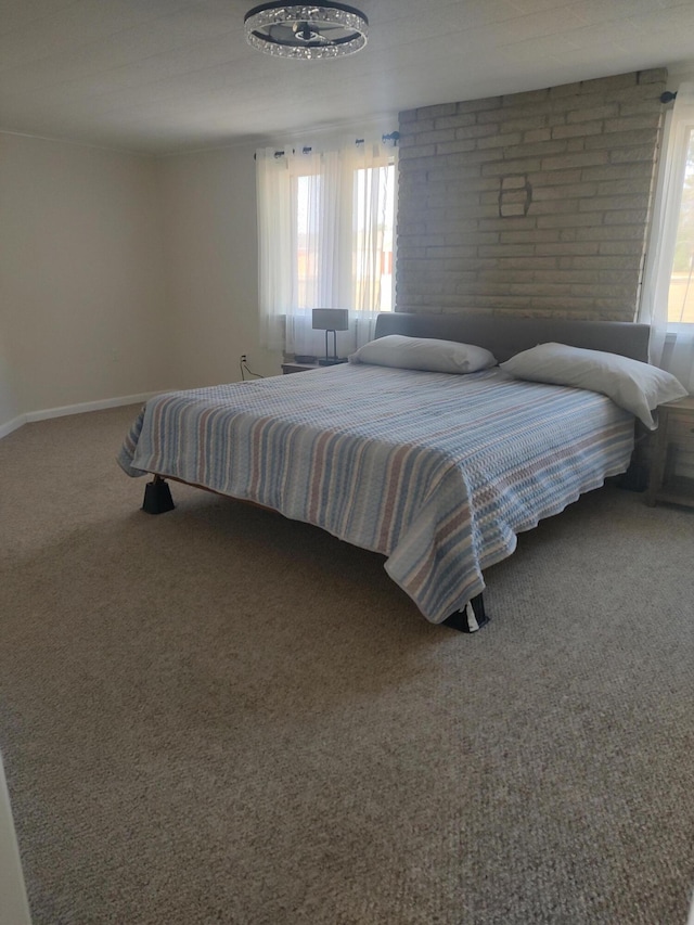 bedroom with carpet and baseboards