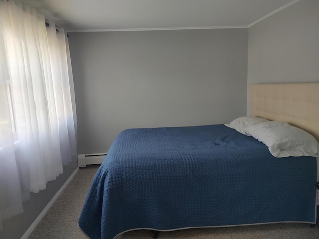 carpeted bedroom featuring a baseboard heating unit, multiple windows, and crown molding