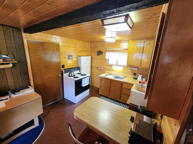 kitchen with white appliances, a sink, light countertops, wood ceiling, and wood walls