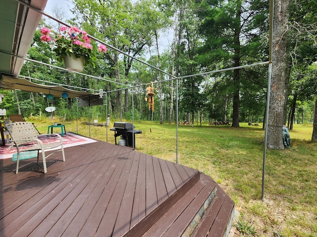 deck with a lawn and a grill