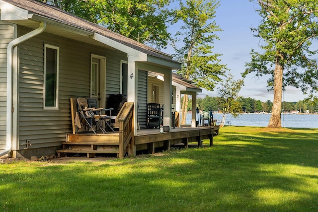 3551 W Otsego Lake Dr, Gaylord, MI 49735 - deck with a water view and a lawn