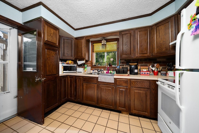 3551 W Otsego Lake Dr, Gaylord, MI 49735 - kitchen featuring white appliances, light tile patterned flooring, ornamental molding, light countertops, and a textured ceiling