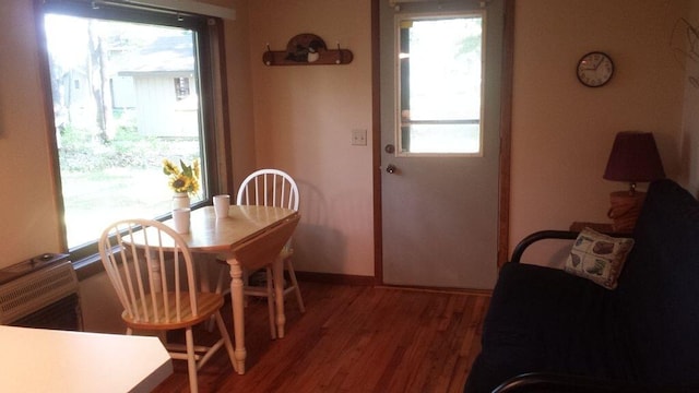 3551 W Otsego Lake Dr, Gaylord, MI 49735 - dining area featuring baseboards and wood finished floors