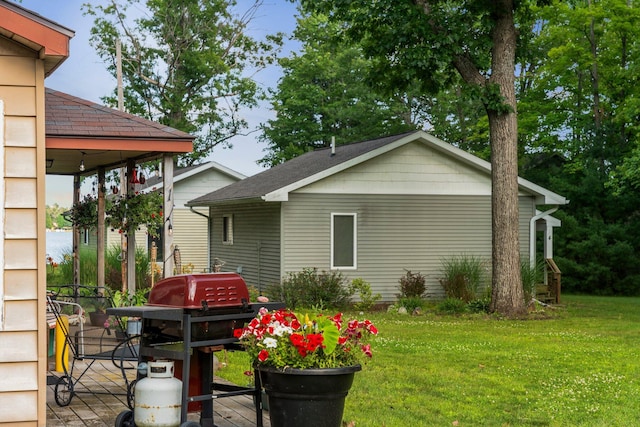 3551 W Otsego Lake Dr, Gaylord, MI 49735 - back of house with a lawn