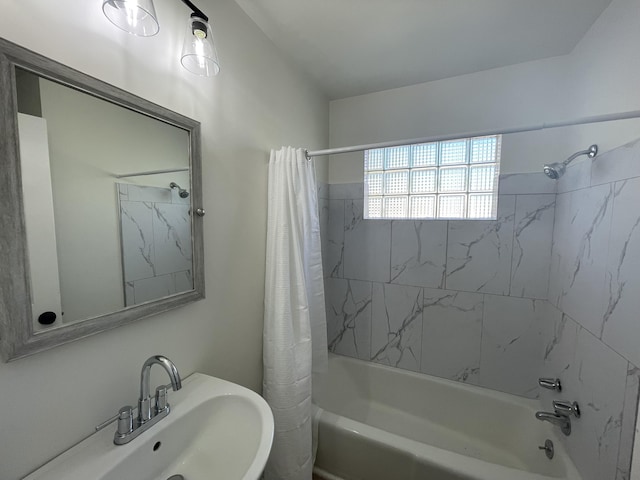 full bathroom with a sink and shower / bath combo