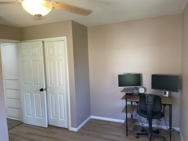 home office with ceiling fan, baseboards, and wood finished floors