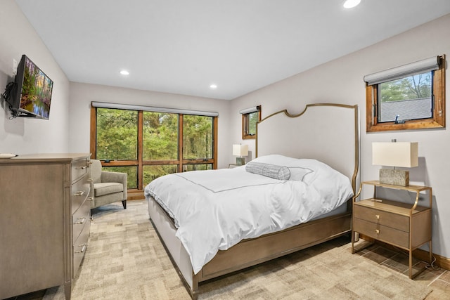 bedroom featuring recessed lighting, baseboards, and light carpet