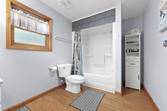 full bath with visible vents, baseboards, toilet, and wood finished floors