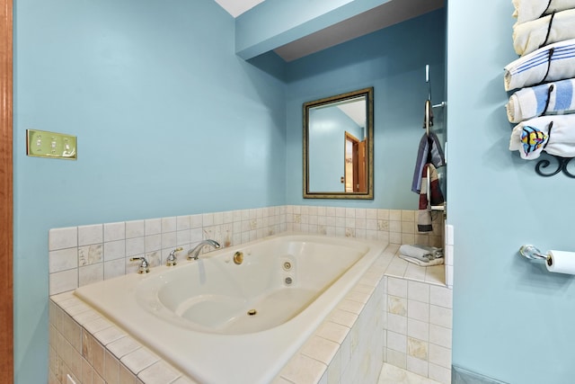 full bathroom featuring a tub with jets