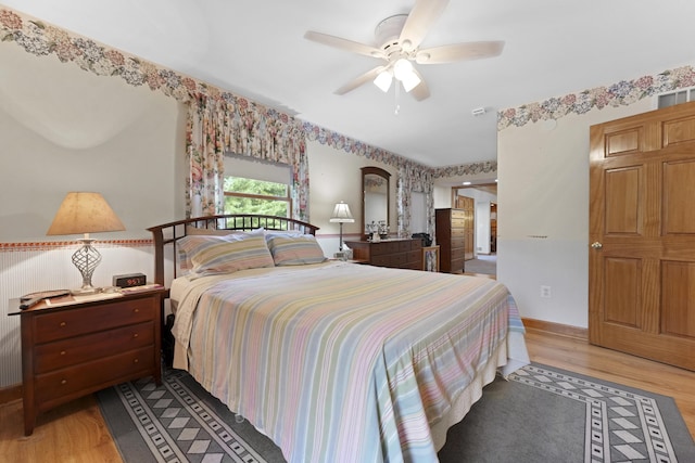 bedroom featuring a ceiling fan and light wood finished floors