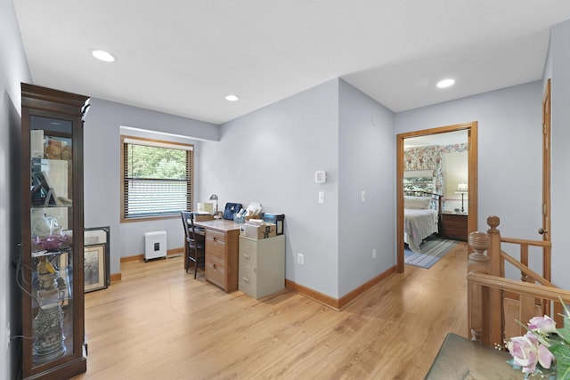 office space with recessed lighting, baseboards, and light wood finished floors