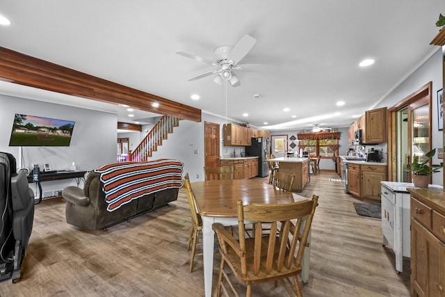 dining room with stairs, recessed lighting, light wood finished floors, and ceiling fan