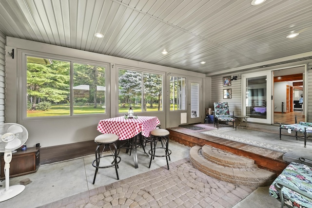 sunroom featuring wooden ceiling