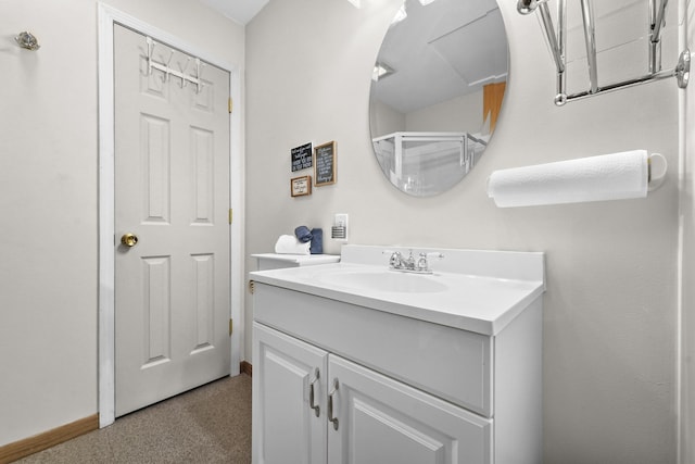 bathroom with vanity and baseboards