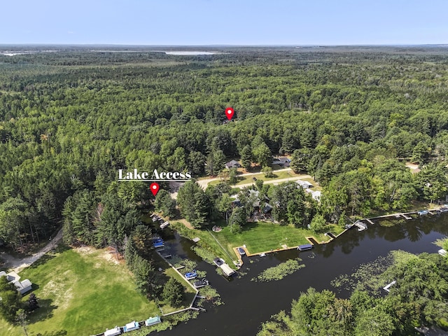 bird's eye view with a forest view and a water view