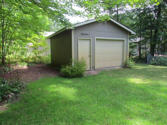 detached garage featuring driveway