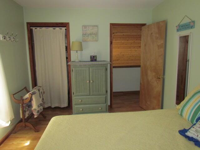 bedroom with wood finished floors