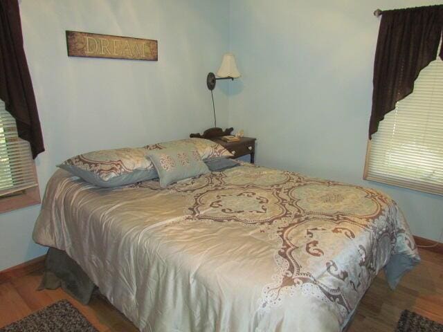 bedroom featuring wood finished floors