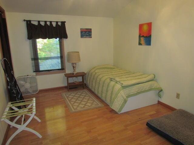 bedroom featuring wood finished floors