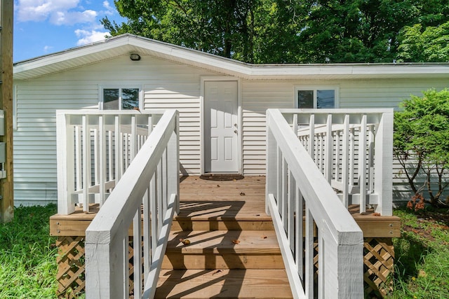 view of exterior entry featuring a deck