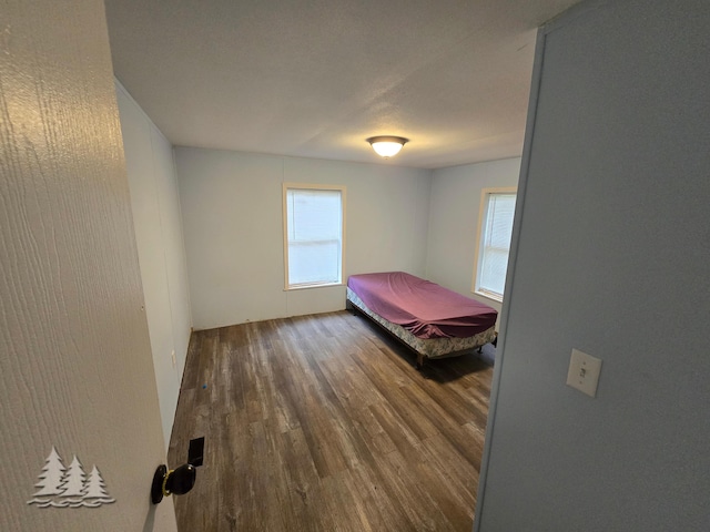 unfurnished bedroom featuring wood finished floors