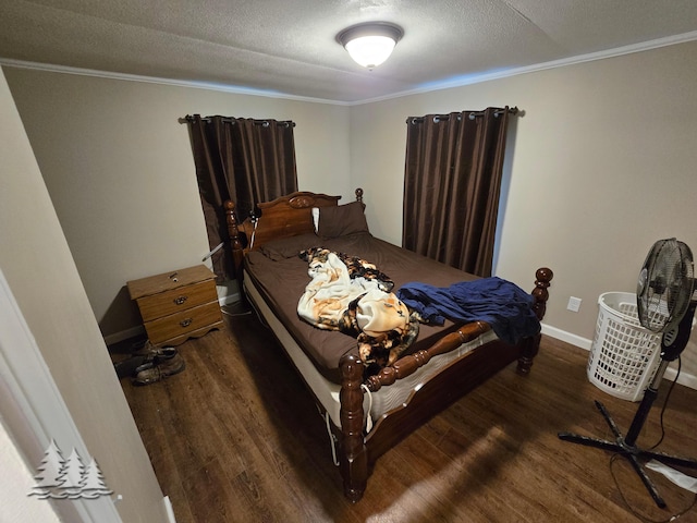 bedroom with crown molding, wood finished floors, baseboards, and a textured ceiling