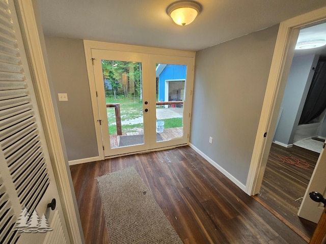 doorway featuring french doors, baseboards, and dark wood-style flooring