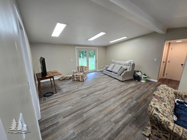 living room with vaulted ceiling with beams, baseboards, and wood finished floors