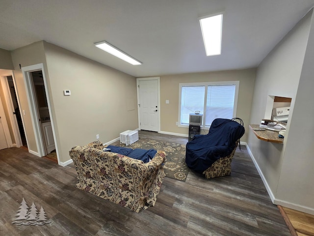 sitting room featuring baseboards and wood finished floors