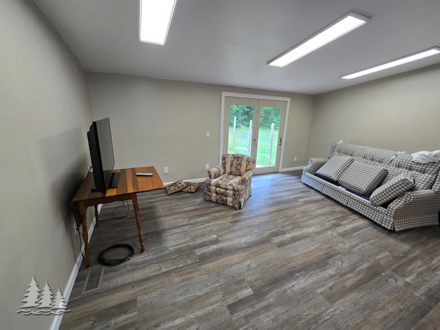 living area featuring wood finished floors and baseboards