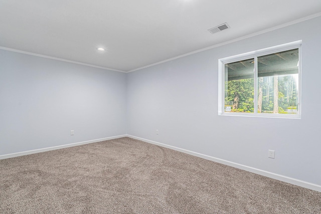 carpeted spare room with recessed lighting, visible vents, baseboards, and ornamental molding