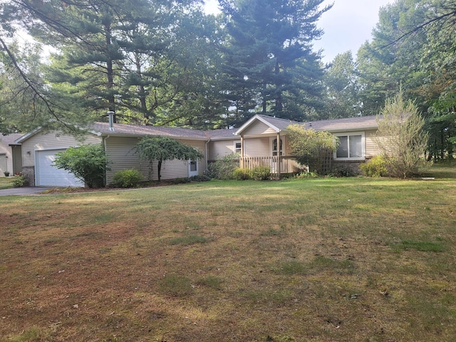 single story home with an attached garage and a front yard