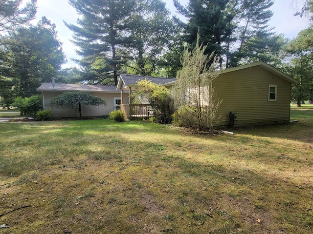 view of yard featuring a wooden deck