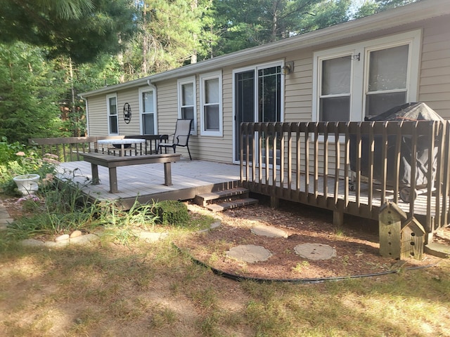 exterior space featuring a wooden deck