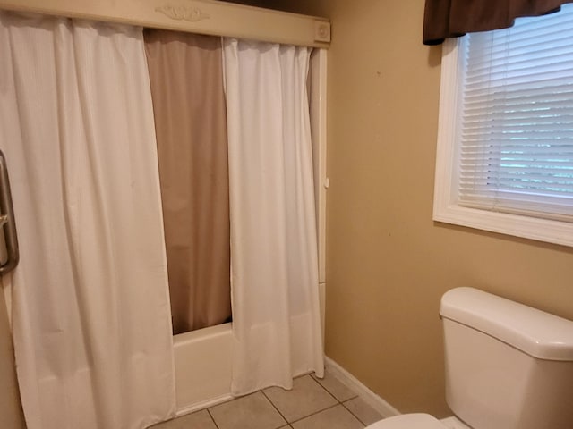 full bathroom with tile patterned floors, baseboards, toilet, and shower / bath combo