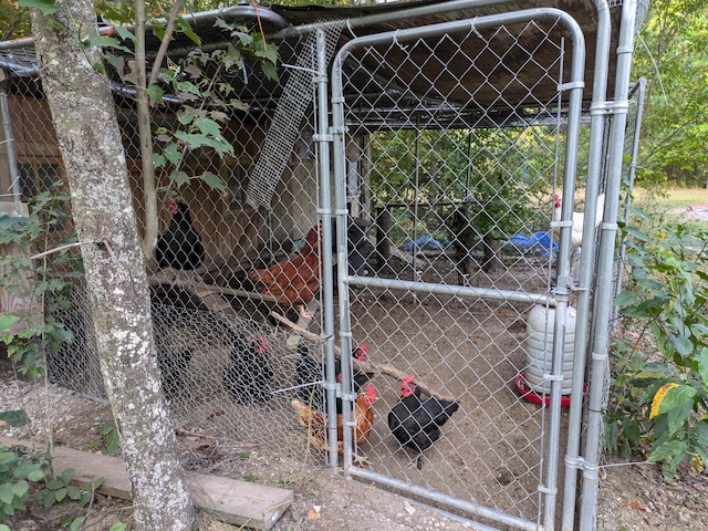 view of gate with an outdoor structure