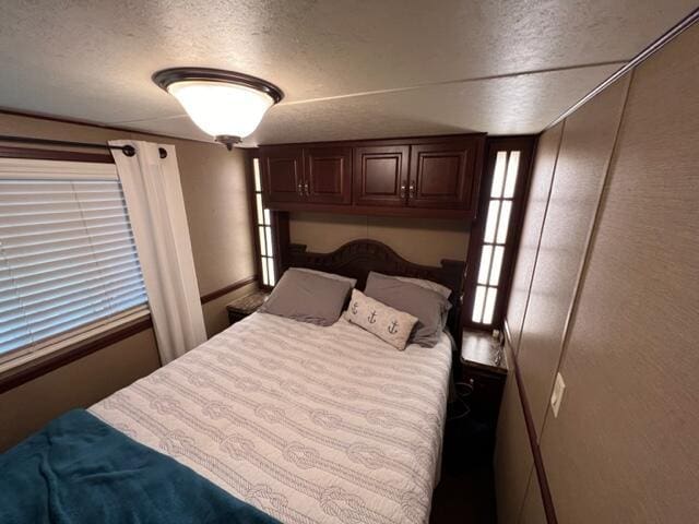 bedroom featuring a textured ceiling